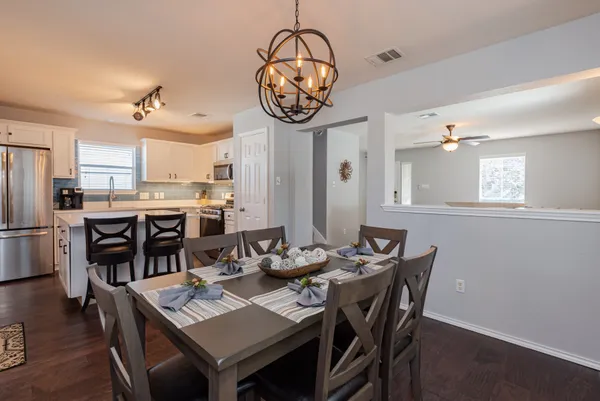 a view of a dining room with furniture window and wooden floor