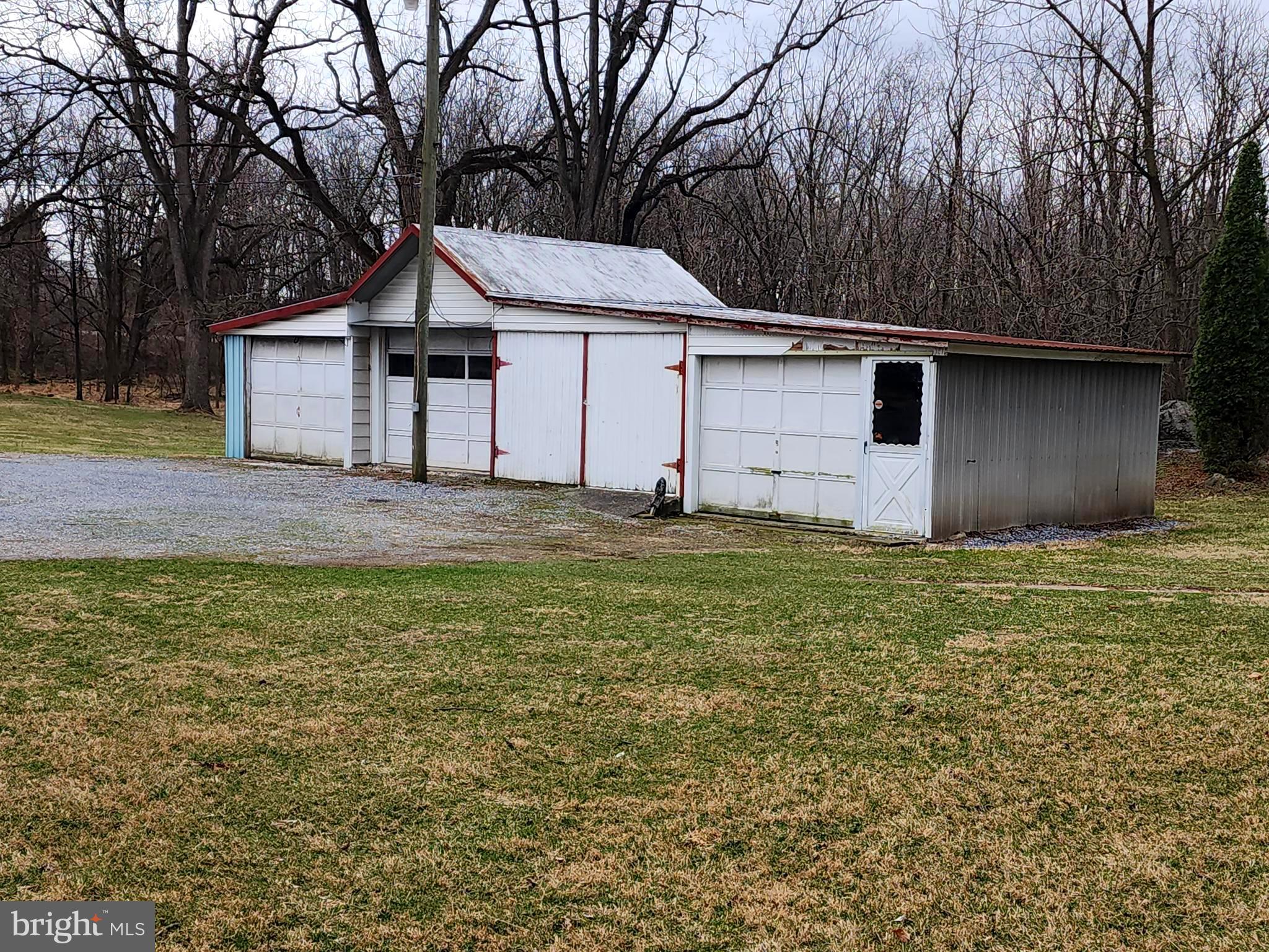 1376 Nolts Road Chambersburg, PA 17202 - Photo 13 of 15 a white house that has tree in front of it