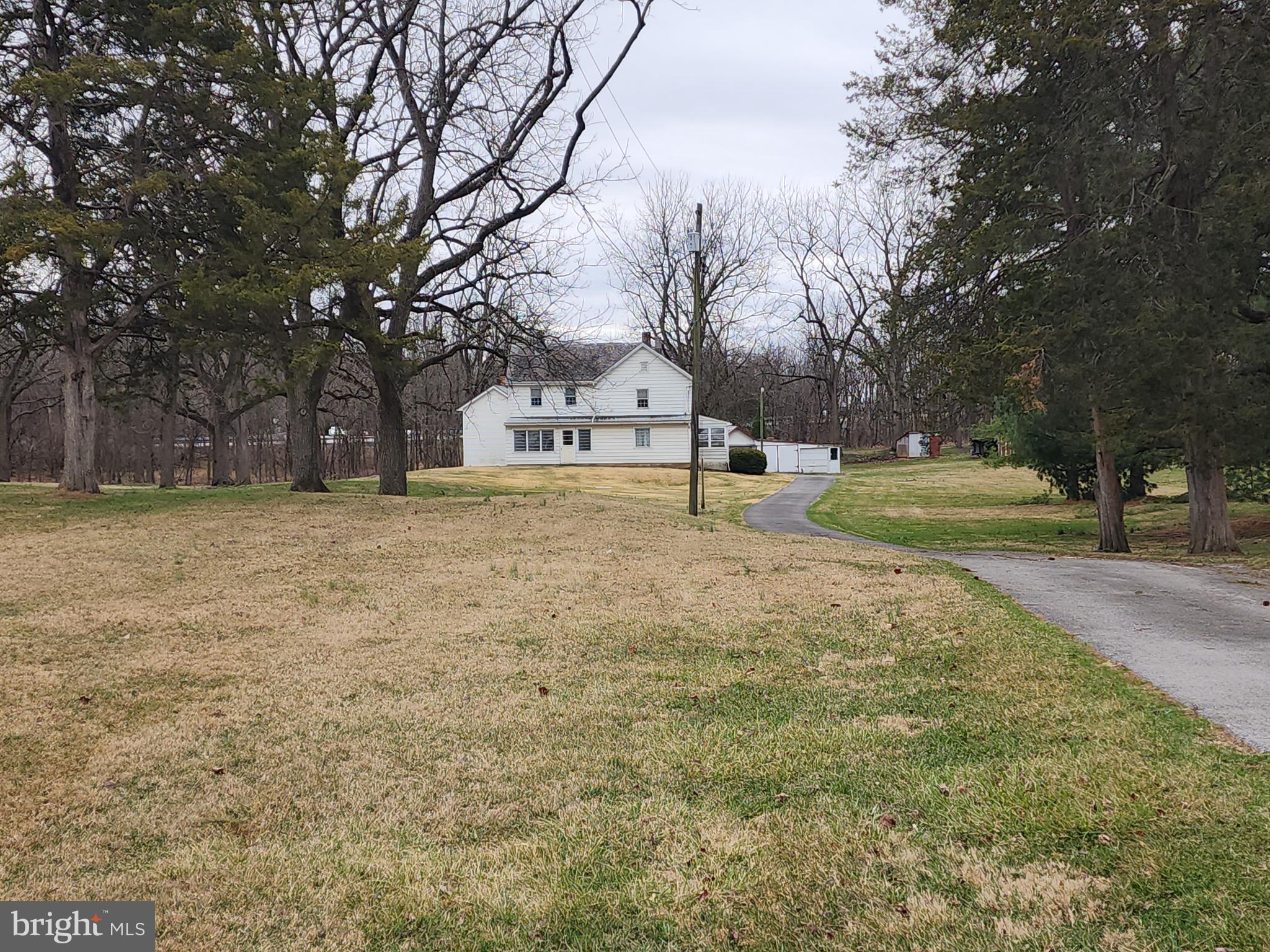 1376 Nolts Road Chambersburg, PA 17202 - Photo 5 of 15 a view of a yard with a house and trees in the background