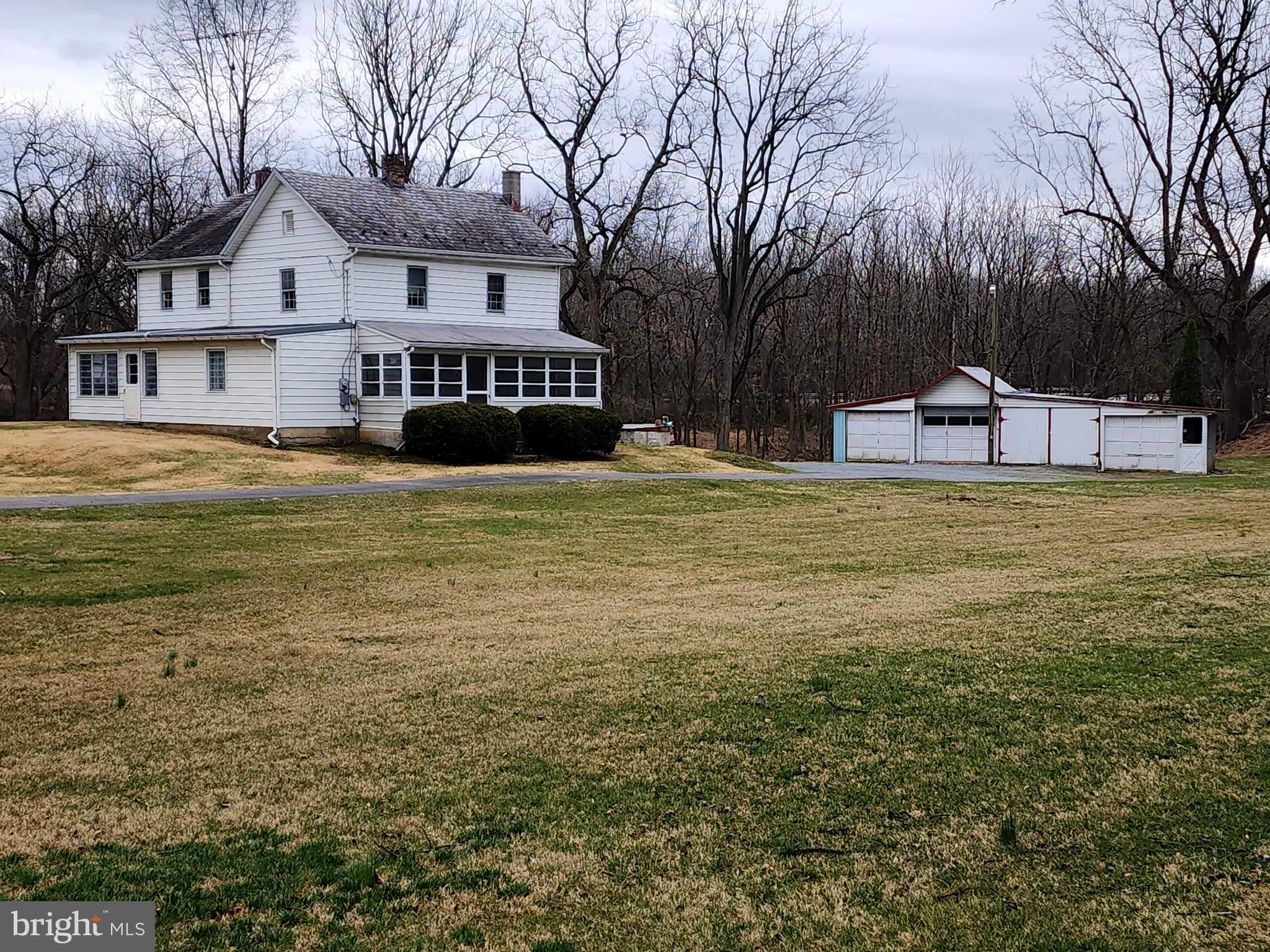 1376 Nolts Road Chambersburg, PA 17202 - Photo 6 of 15 a view of a house with a big yard and large trees