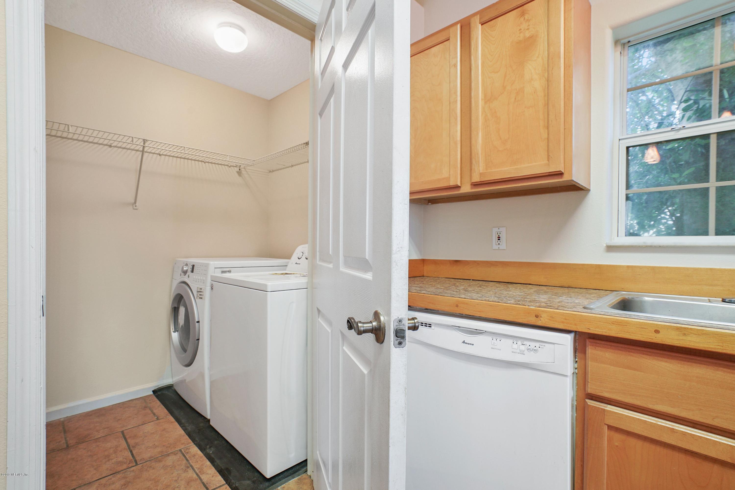 161 Cedar Ridge Circle St. Augustine, FL 32080 - Photo 11 of 31 a view of a storage and utility room with washer and dryer