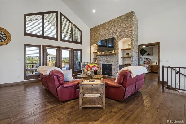 a living room with furniture fireplace and flat screen tv