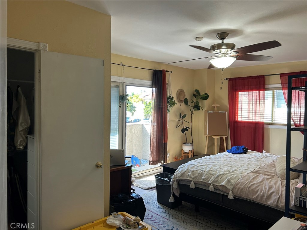 2305 Rockefeller Lane, Unit A Redondo Beach, CA 90278 - Photo 12 of 53 a bedroom with a bed ceiling fan and a window
