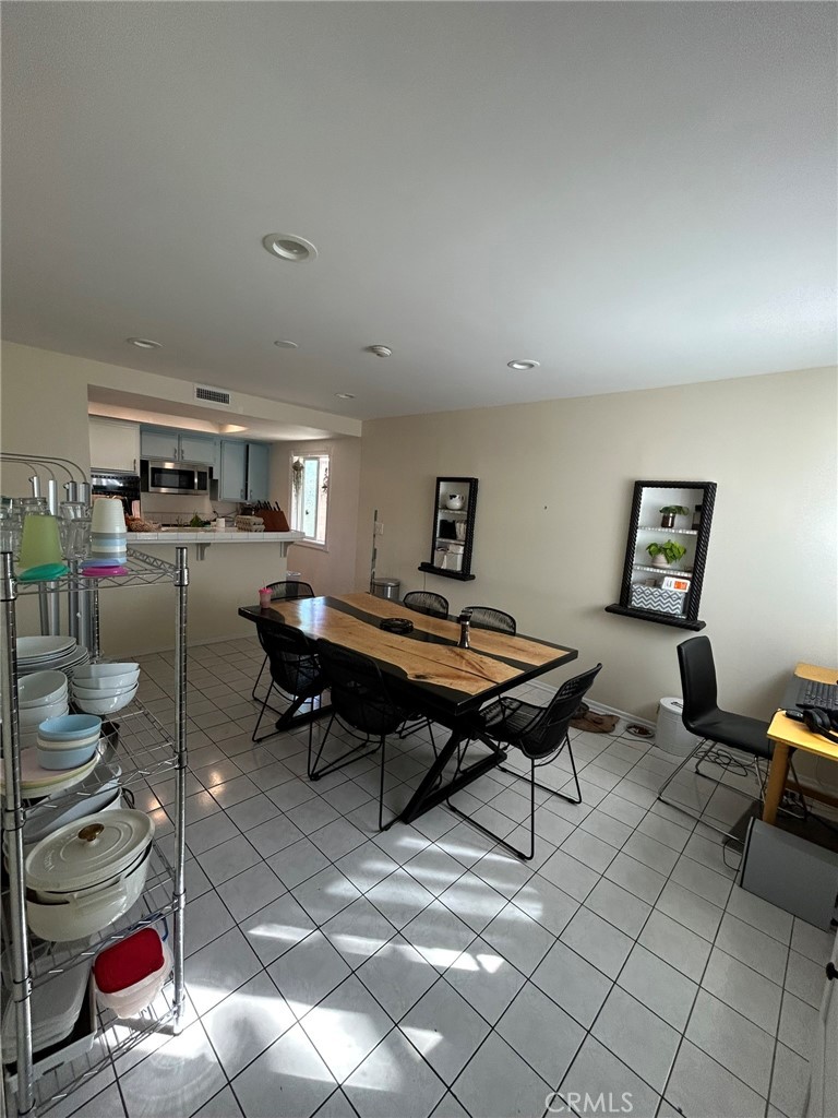 2305 Rockefeller Lane, Unit A Redondo Beach, CA 90278 - Photo 20 of 53 a living room with lots of furniture and a wooden floor