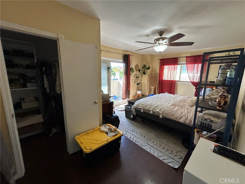 2305 Rockefeller Lane, Unit A Redondo Beach, CA 90278 - Photo 23 of 53 a bedroom with a bed and a chandelier