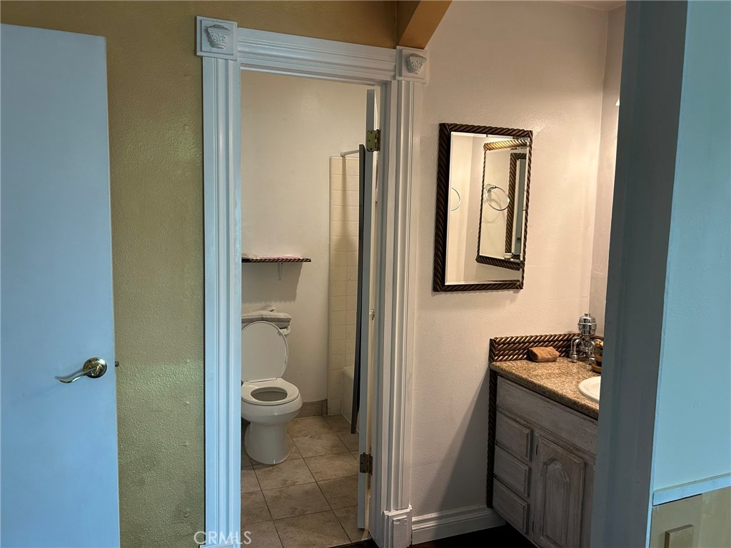 2305 Rockefeller Lane, Unit A Redondo Beach, CA 90278 - Photo 33 of 53 a bathroom with a granite countertop sink and a mirror
