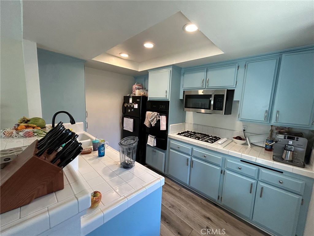 2305 Rockefeller Lane, Unit A Redondo Beach, CA 90278 - Photo 39 of 53 a kitchen that has a sink and a stove