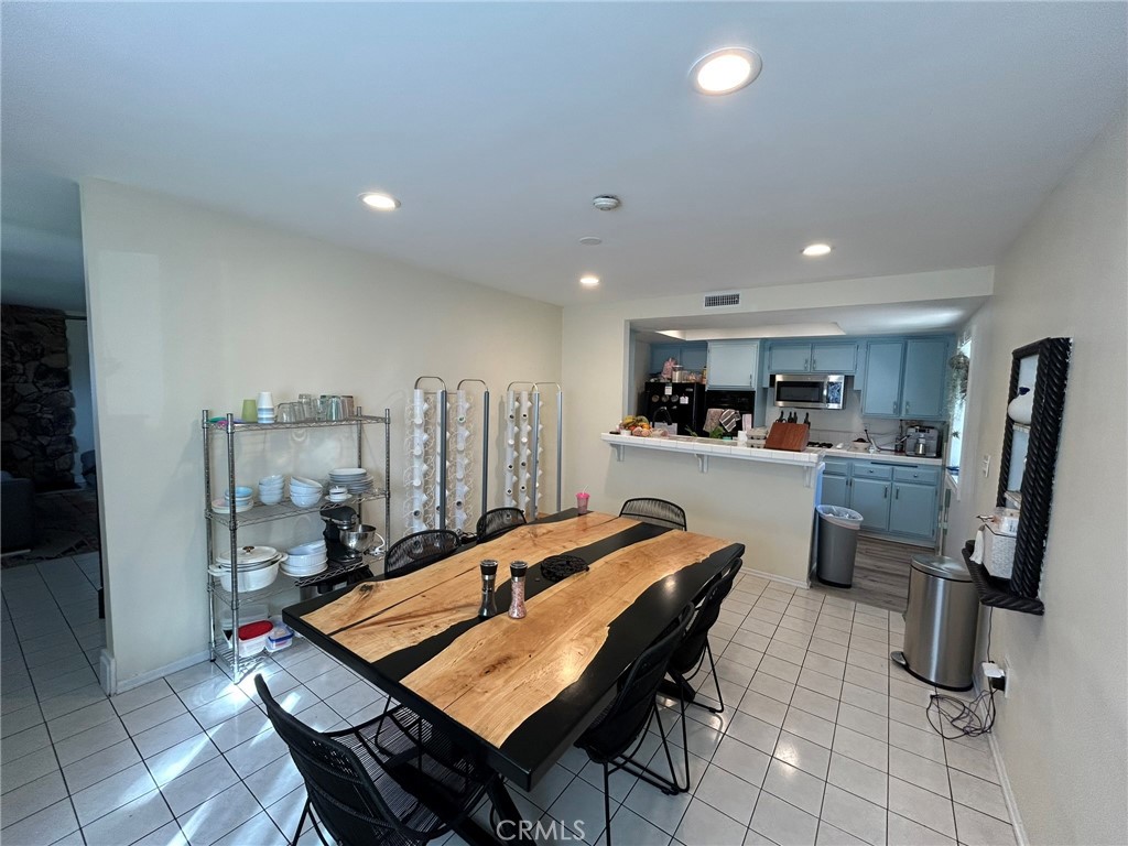 2305 Rockefeller Lane, Unit A Redondo Beach, CA 90278 - Photo 44 of 53 a dining room with a table and chairs