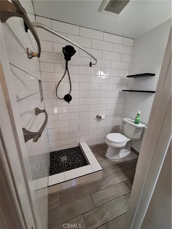 a view of a hallway with washer and dryer