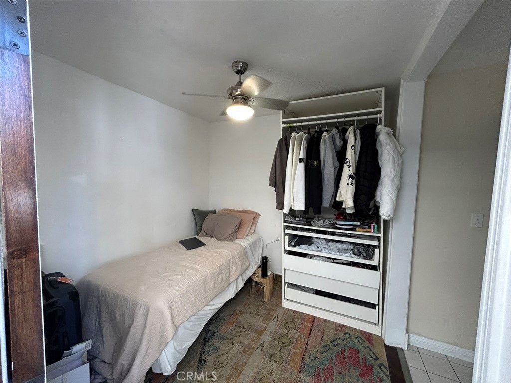 2305 Rockefeller Lane, Unit A Redondo Beach, CA 90278 - Photo 53 of 53 a bedroom with a bed and a chandelier