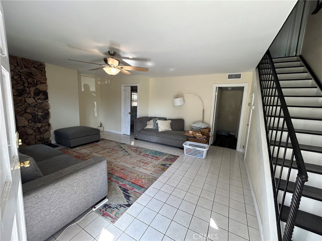 2305 Rockefeller Lane, Unit A Redondo Beach, CA 90278 - Photo 6 of 53 a living room with furniture and a chandelier