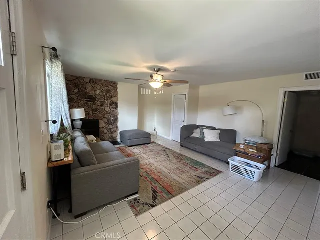 a view of a hallway with furniture