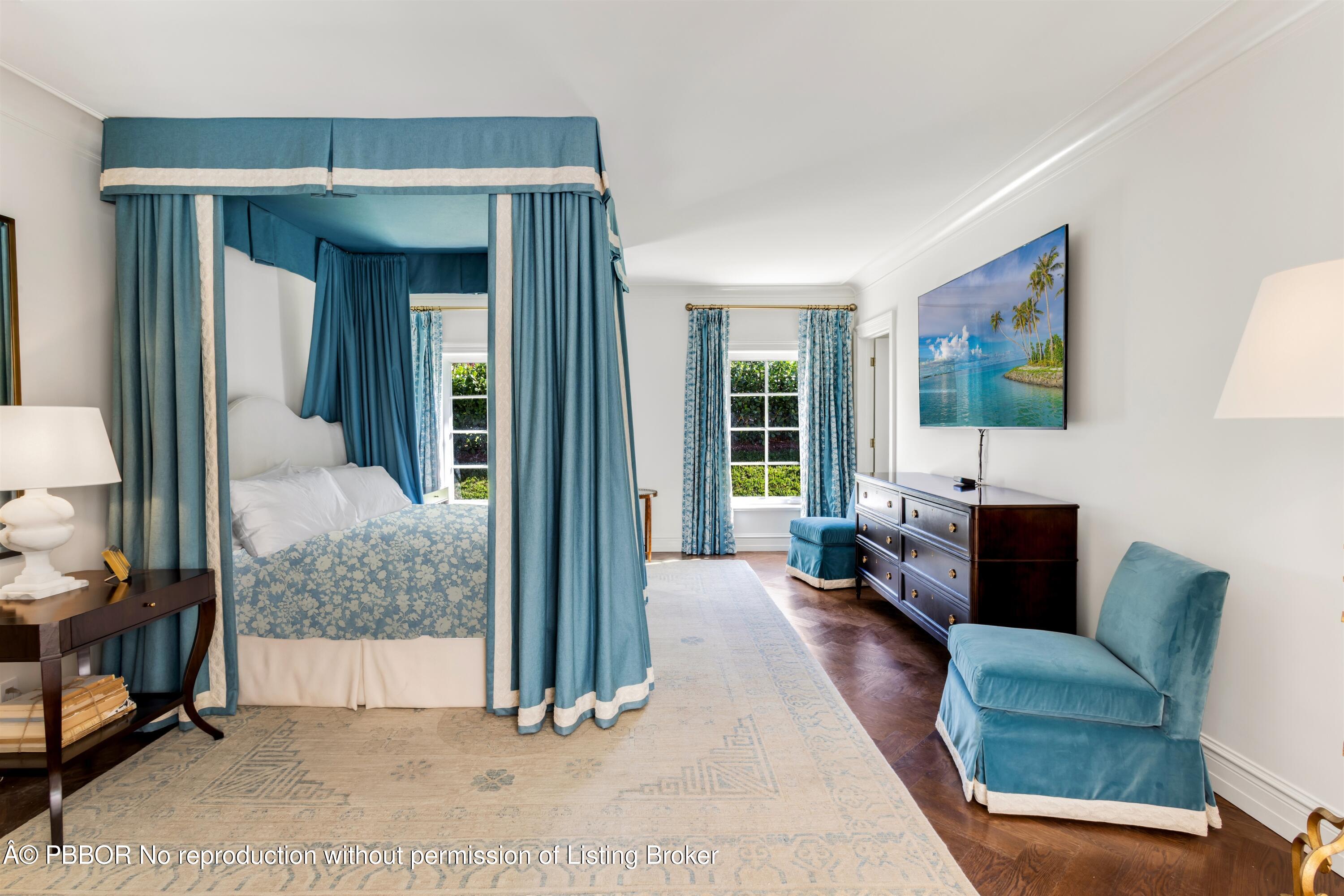 124 Woodbridge Road Palm Beach, FL 33480 - Photo 23 of 44 a living room with furniture and a flat screen tv