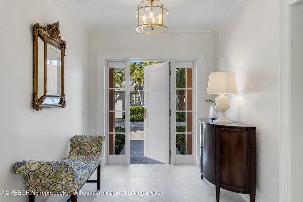 a living room with furniture a flat screen tv and a large window