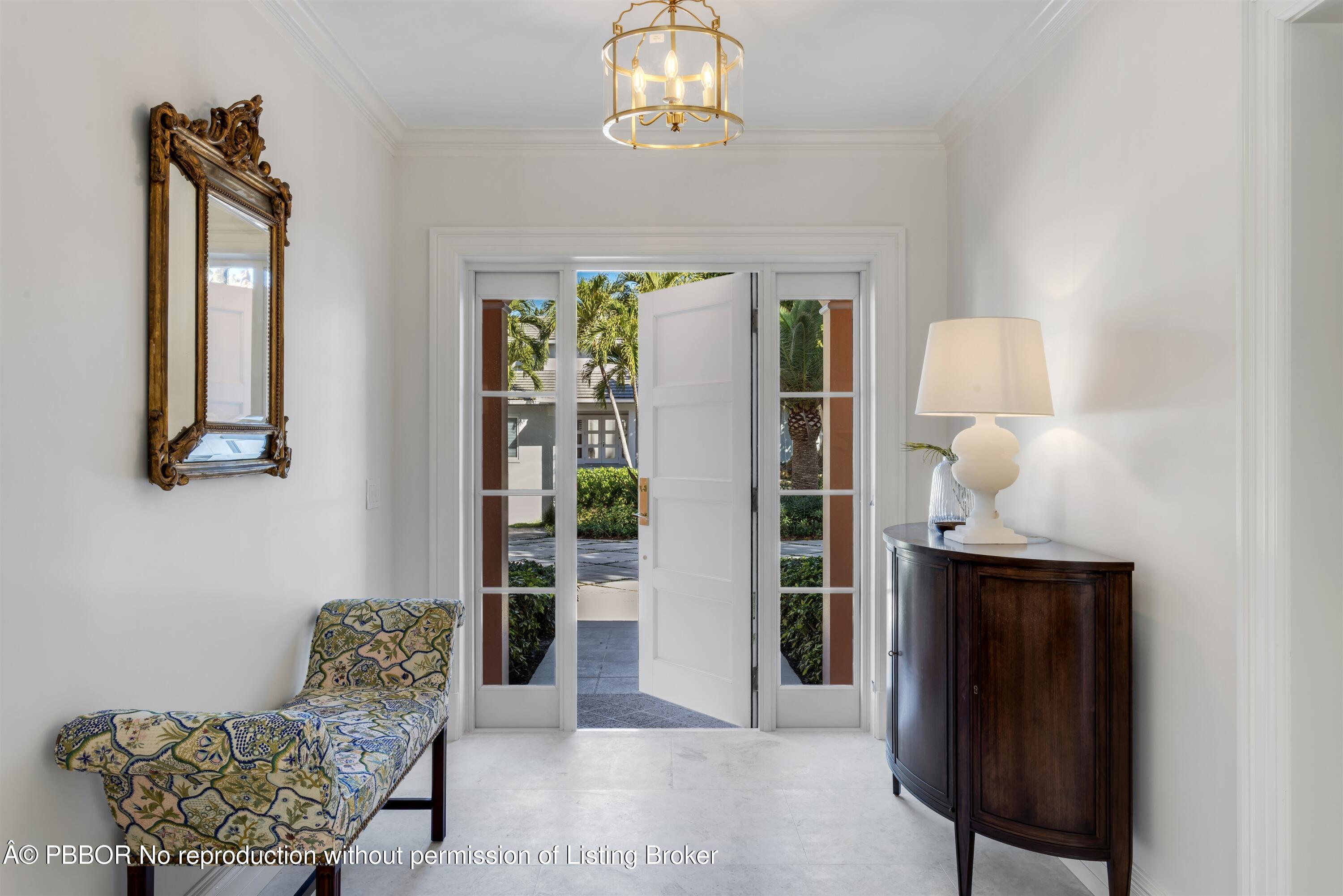 124 Woodbridge Road Palm Beach, FL 33480 - Photo 7 of 44 a living room with furniture and a window