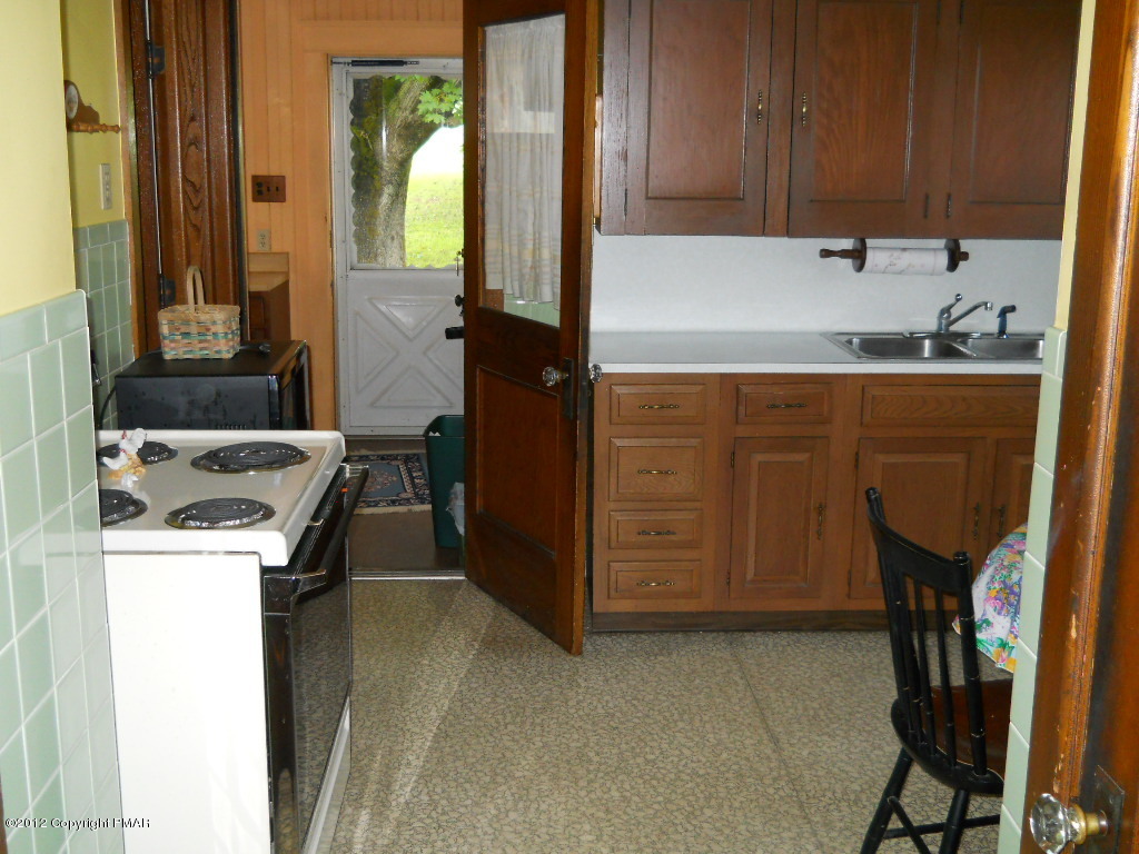 887 Bangor Road Nazareth, PA 18064 - Photo 4 of 11 a kitchen with a sink a stove and a refrigerator