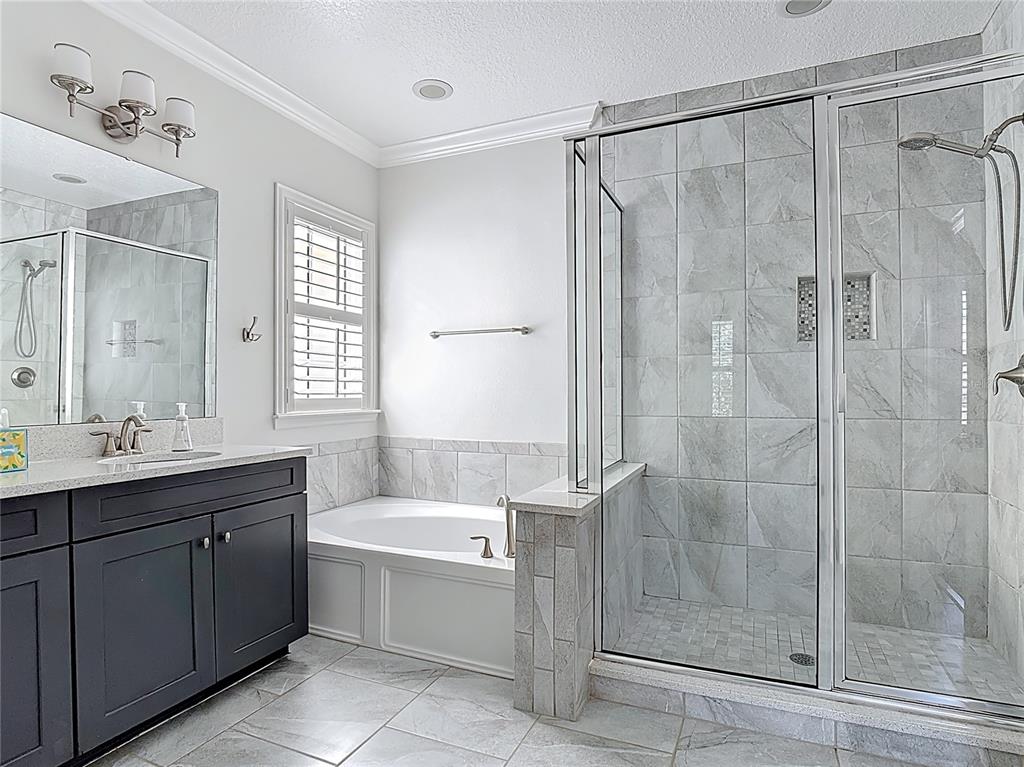 1513 Resolute Street Celebration, FL 34747 - Photo 30 of 43 a bathroom with a tub sink shower and mirror