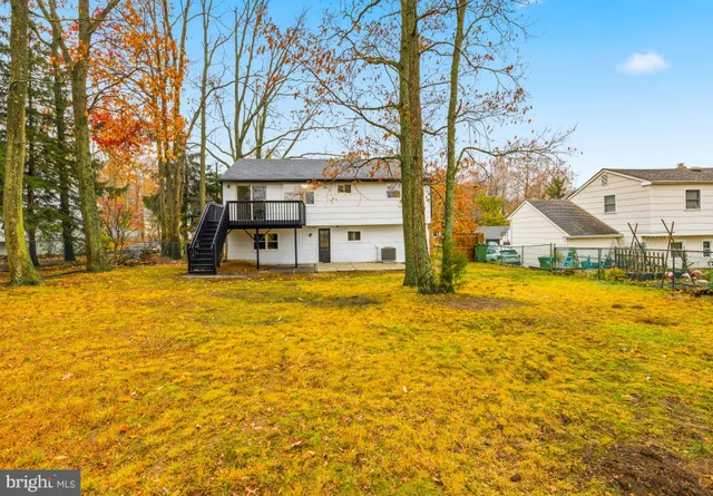 a house view with swimming pool in front of house