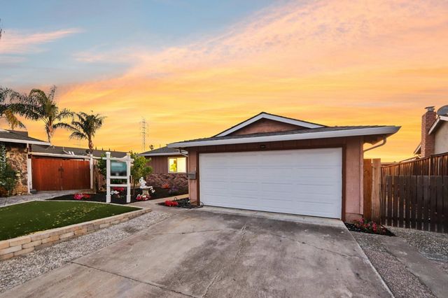 an aerial view of a houses with a street