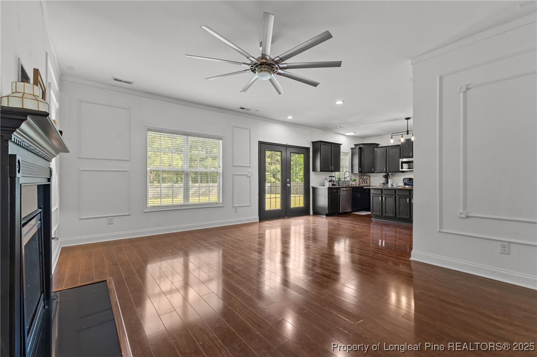 315 St Johns Loop Raeford, NC 28376 - Photo 20 of 47 a view of an empty room with window and wooden floor