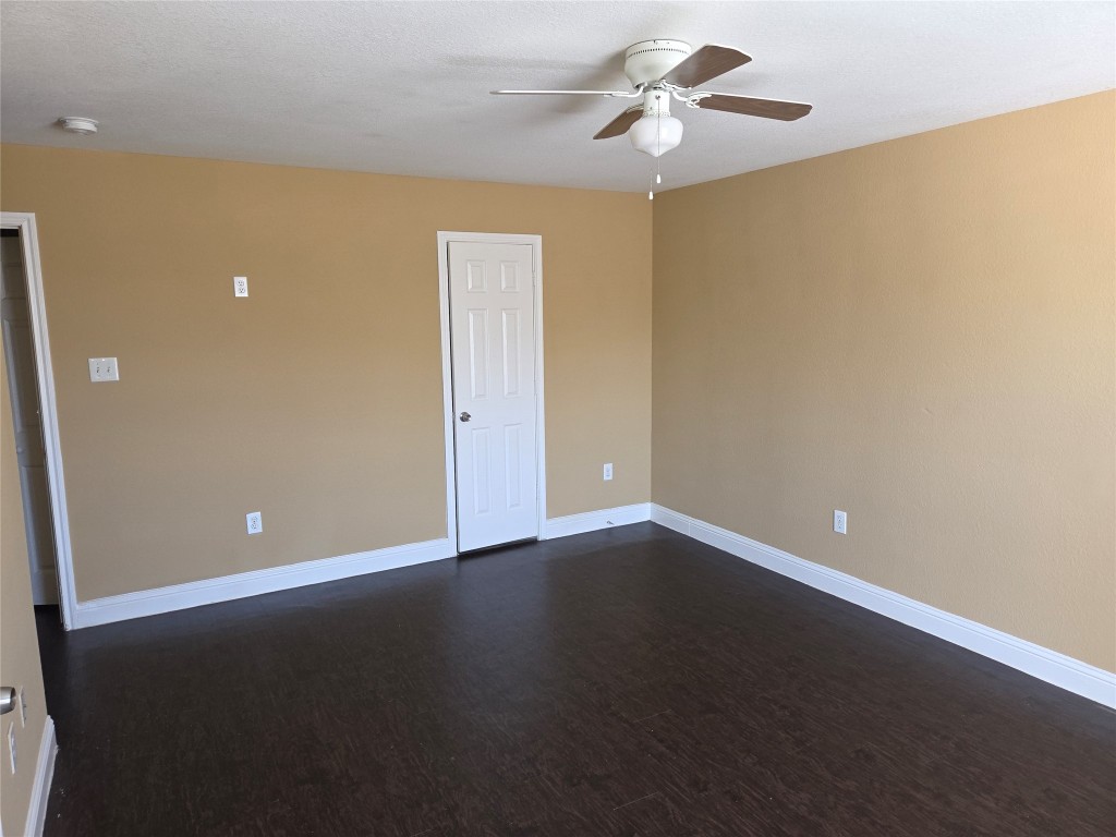 7709 Rhobell Street, Unit B Houston, TX 77016 - Photo 16 of 21 a view of an empty room with a ceiling fan and window