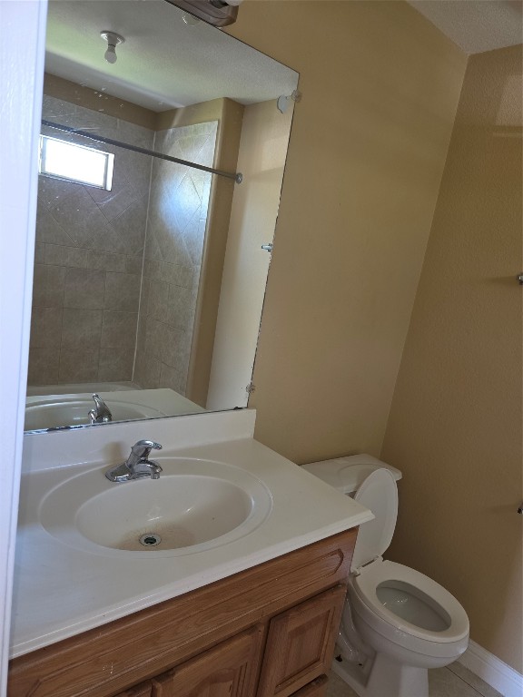 7709 Rhobell Street, Unit B Houston, TX 77016 - Photo 18 of 21 a bathroom with a sink a toilet a mirror and shower