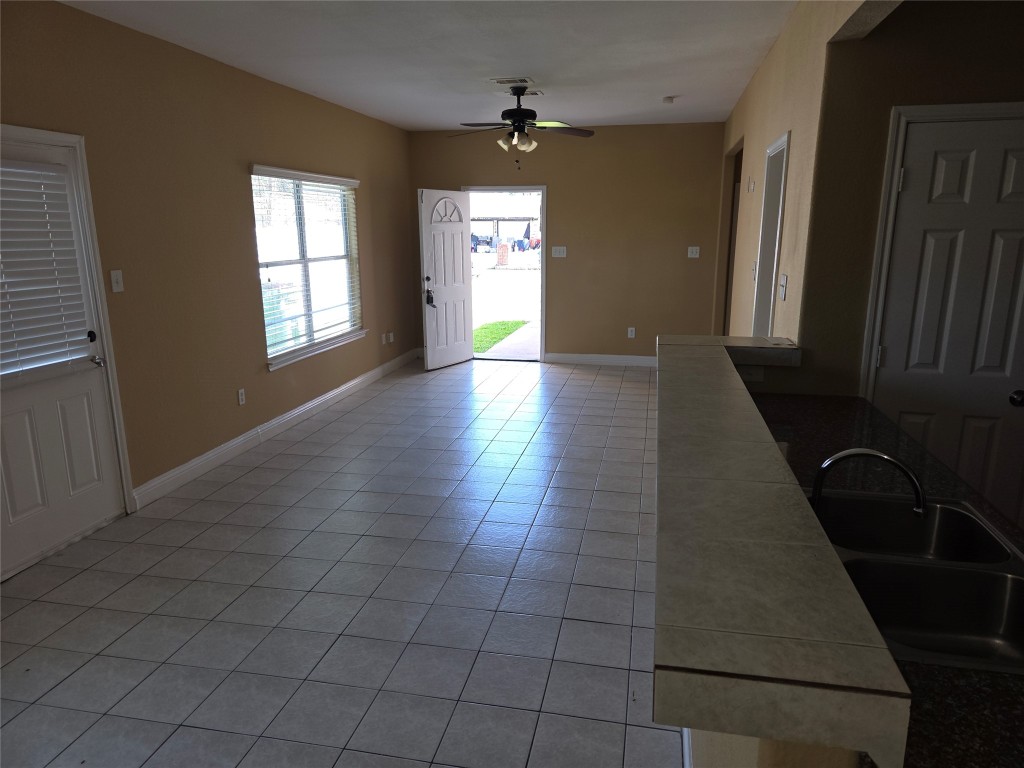 7709 Rhobell Street, Unit B Houston, TX 77016 - Photo 4 of 21 wooden floor in an empty room with a window