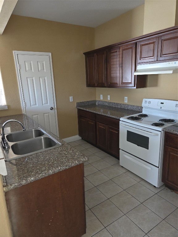 7709 Rhobell Street, Unit B Houston, TX 77016 - Photo 6 of 21 a kitchen with stainless steel appliances granite countertop a sink stove and cabinets