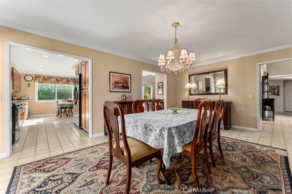 19512 Sierra Mia Road Irvine, CA 92603 - Photo 13 of 46 a view of a dining room with furniture window and wooden floor