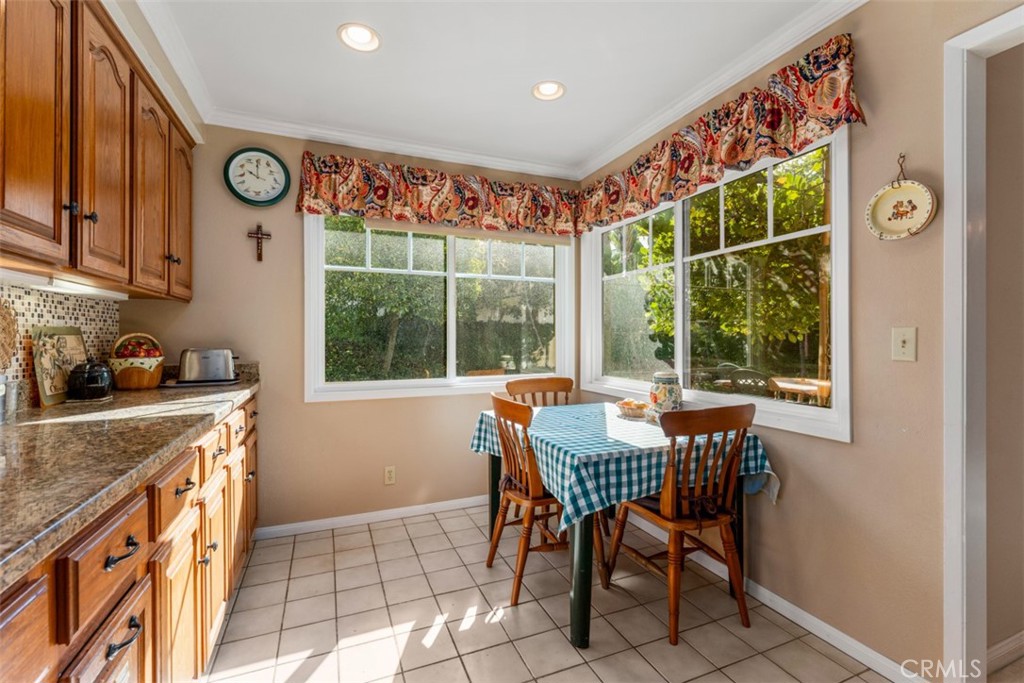 19512 Sierra Mia Road Irvine, CA 92603 - Photo 18 of 46 a dining area with a stove a sink and a window