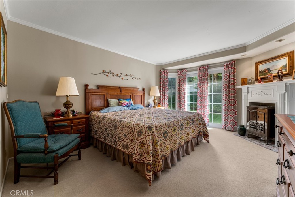 19512 Sierra Mia Road Irvine, CA 92603 - Photo 19 of 46 a bed room with a bed and a chair