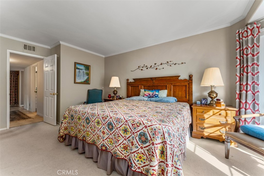 19512 Sierra Mia Road Irvine, CA 92603 - Photo 20 of 46 a bedroom with a bed and a mirror