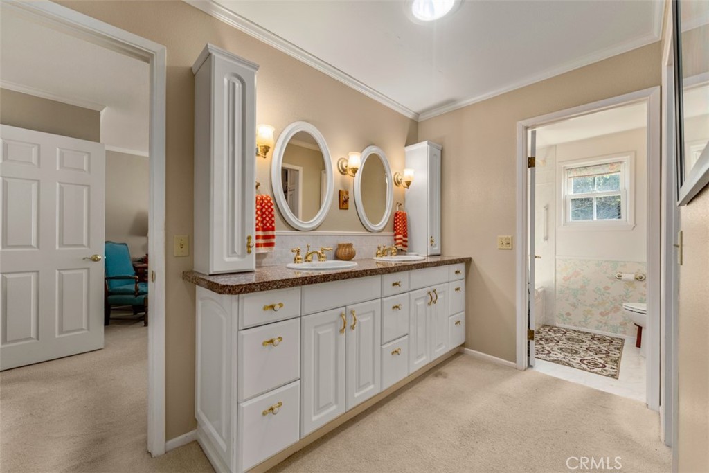 19512 Sierra Mia Road Irvine, CA 92603 - Photo 22 of 46 a spacious bathroom with double vanity and a mirror
