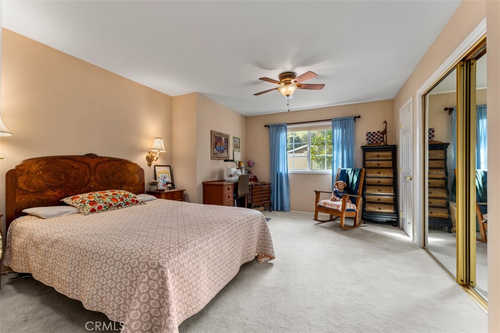 19512 Sierra Mia Road Irvine, CA 92603 - Photo 29 of 46 a bedroom with a bed and a couch