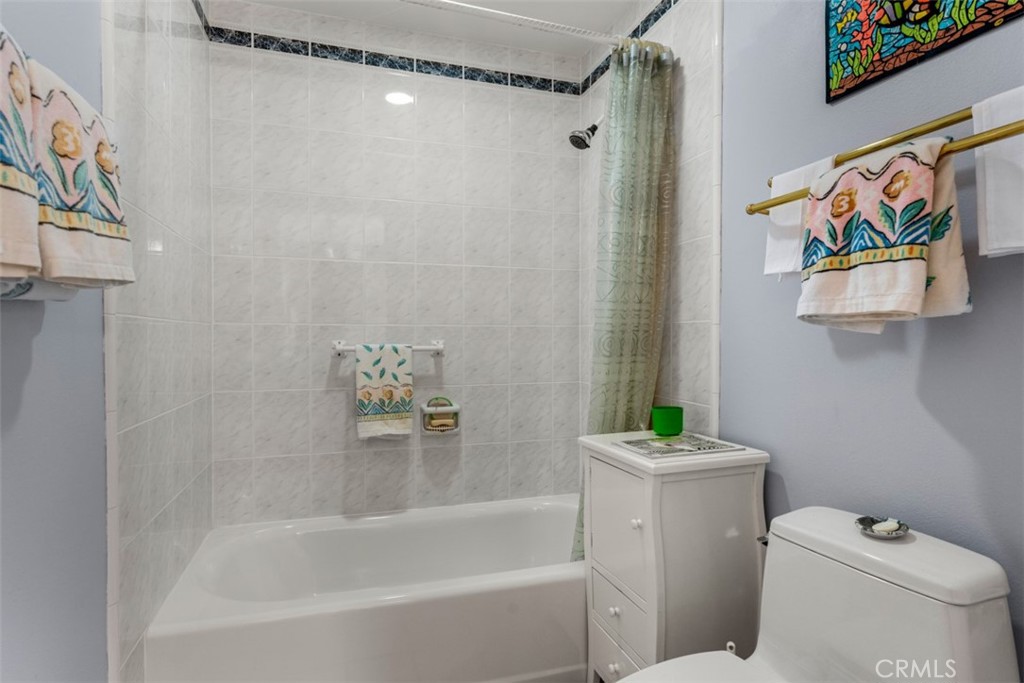 19512 Sierra Mia Road Irvine, CA 92603 - Photo 32 of 46 a bath room with a toilet and a bath tub