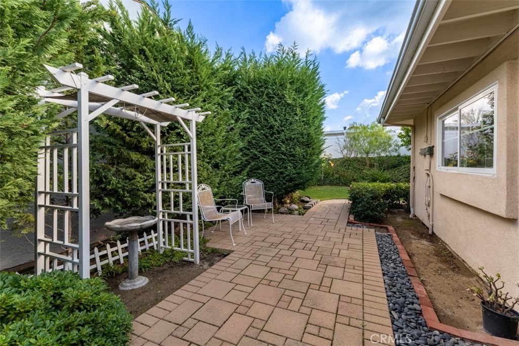 19512 Sierra Mia Road Irvine, CA 92603 - Photo 34 of 46 a view of a patio with table and chairs and potted plants