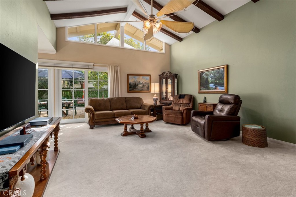 19512 Sierra Mia Road Irvine, CA 92603 - Photo 5 of 46 a living room with furniture a flat screen tv and a window