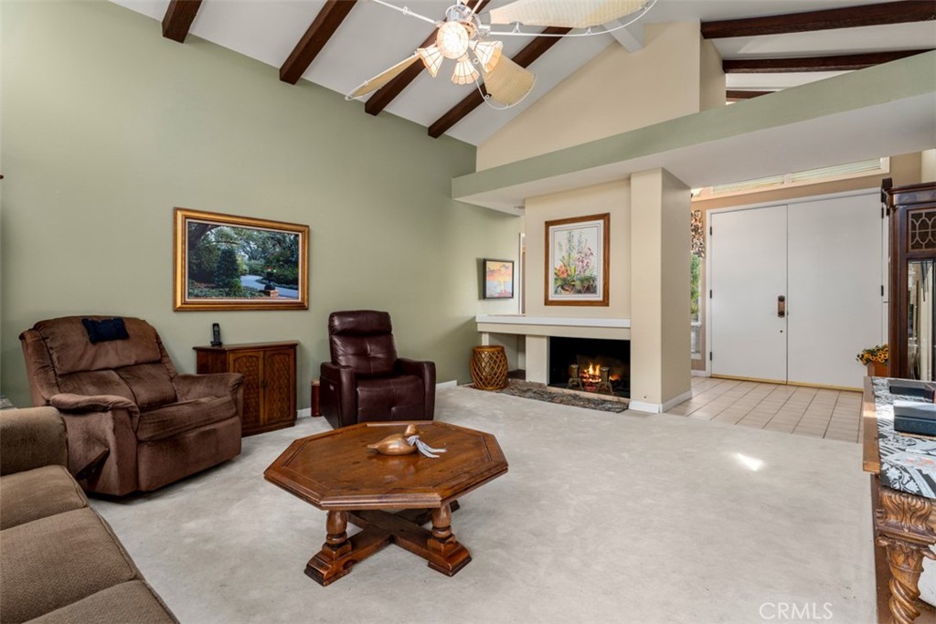 19512 Sierra Mia Road Irvine, CA 92603 - Photo 6 of 46 a living room with furniture and a fireplace