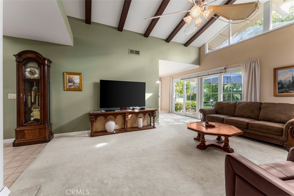 19512 Sierra Mia Road Irvine, CA 92603 - Photo 7 of 46 a living room with furniture and a flat screen tv