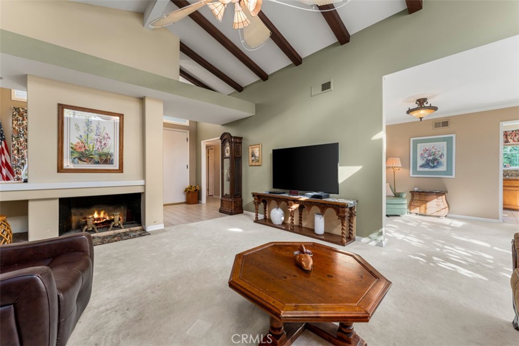19512 Sierra Mia Road Irvine, CA 92603 - Photo 8 of 46 a living room with furniture and a flat screen tv
