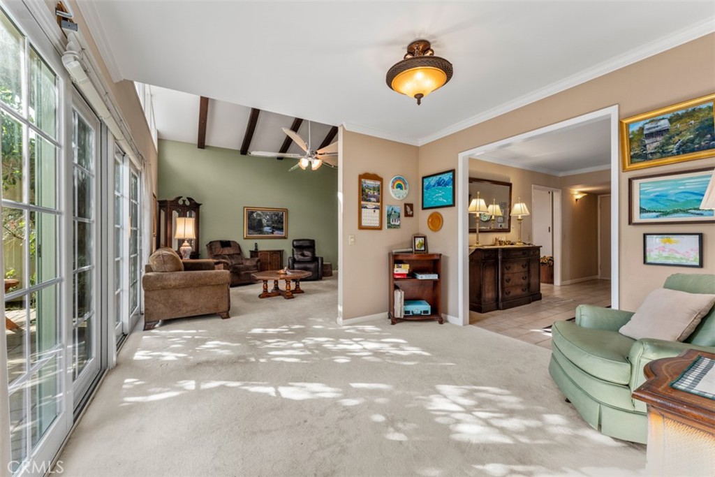 19512 Sierra Mia Road Irvine, CA 92603 - Photo 9 of 46 a living room with furniture and a flat screen tv