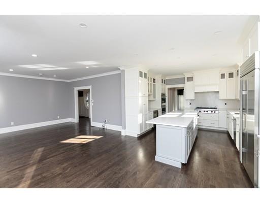 100 Elmwood Road Wellesley, MA 02481 - Photo 11 of 27 a open kitchen with white cabinets and stainless steel appliances
