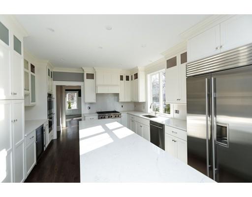 100 Elmwood Road Wellesley, MA 02481 - Photo 13 of 27 a kitchen with stainless steel appliances kitchen island granite countertop a refrigerator a sink a stove and oven