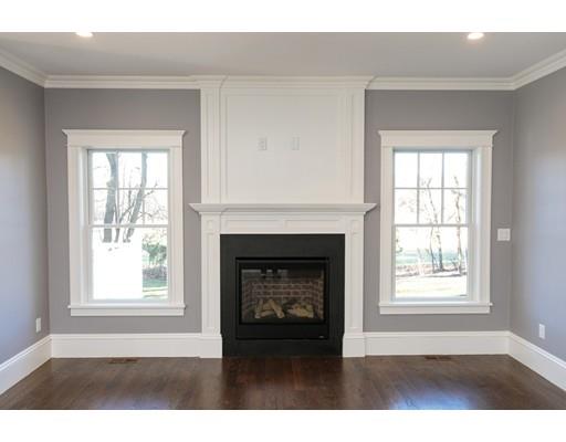 100 Elmwood Road Wellesley, MA 02481 - Photo 16 of 27 a black and white living room with a fireplace