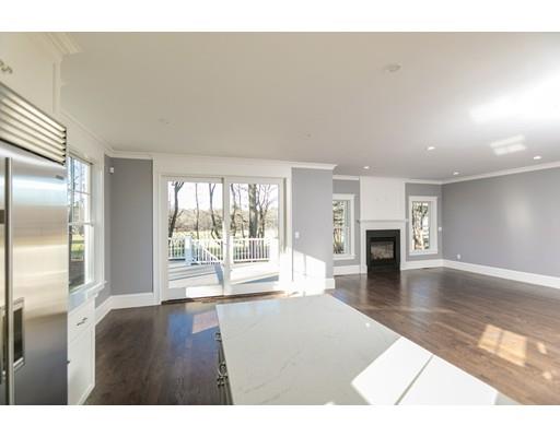 100 Elmwood Road Wellesley, MA 02481 - Photo 10 of 27 a living room with furniture and a fireplace