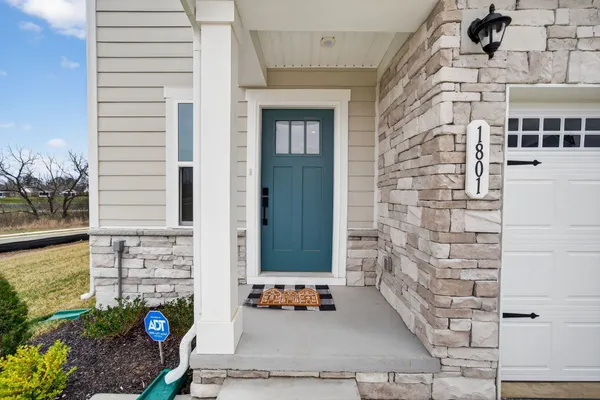 a view of an entryway with wooden floor