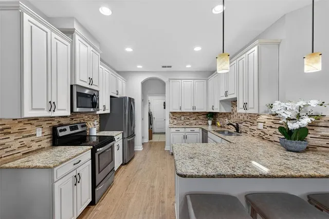 a bathroom with a toilet a sink and a mirror