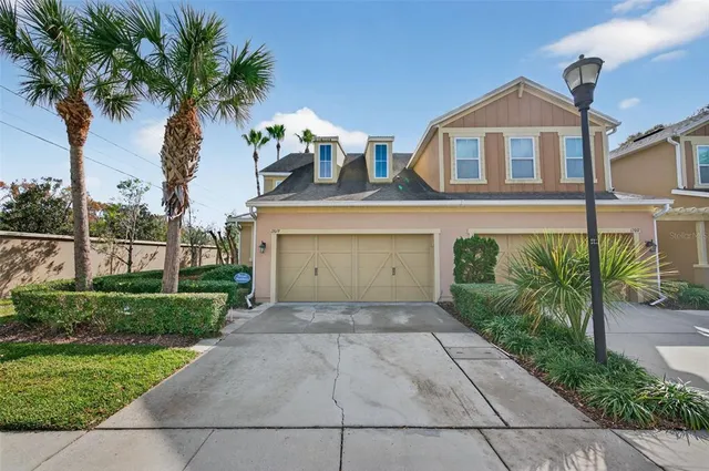 a view of a house with a yard and plants