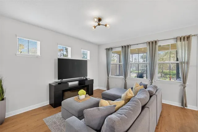 a view of a dining room with furniture window and wooden floor