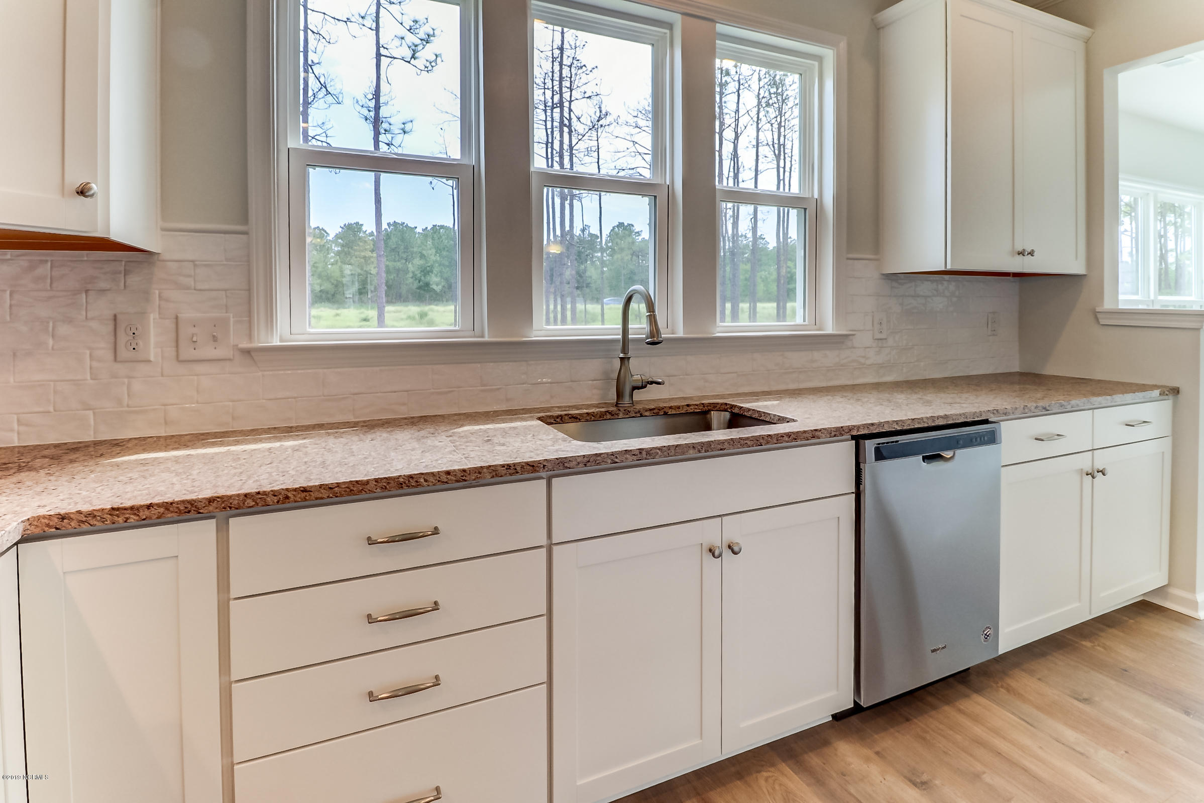 1106 Snowden Road Wilmington, NC 28412 - Photo 4 of 27 Gourmet Kitchen 3, upgraded cabinetry, soft close drawers and doors, pull out shelves, tile backsplash